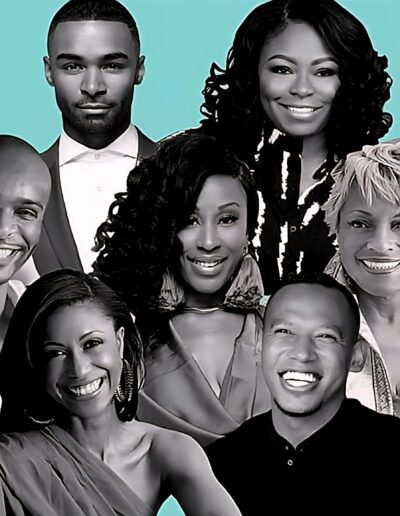 Group portrait of thirteen people, both men and women, posed closely together against a teal background, all facing the camera and smiling.